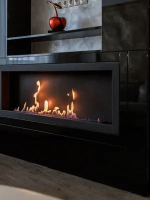 Professional technician inspecting a modern gas fireplace to ensure safety, efficiency, and reliable performance in a cozy home environment.